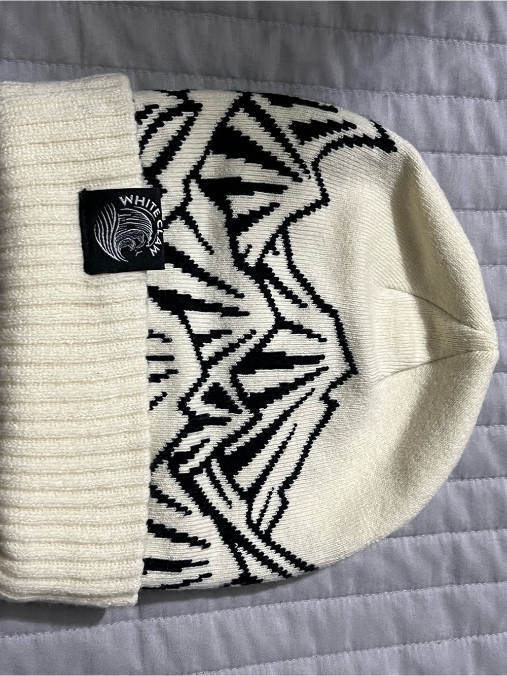 White Claw Branded Knit Beanie with Black Wave Pattern